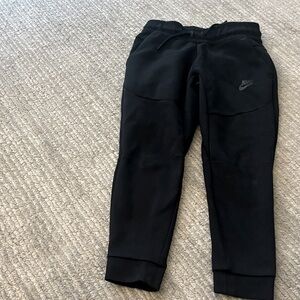 Nike tech style Kids black Joggers sweatpants.  Like new condition.